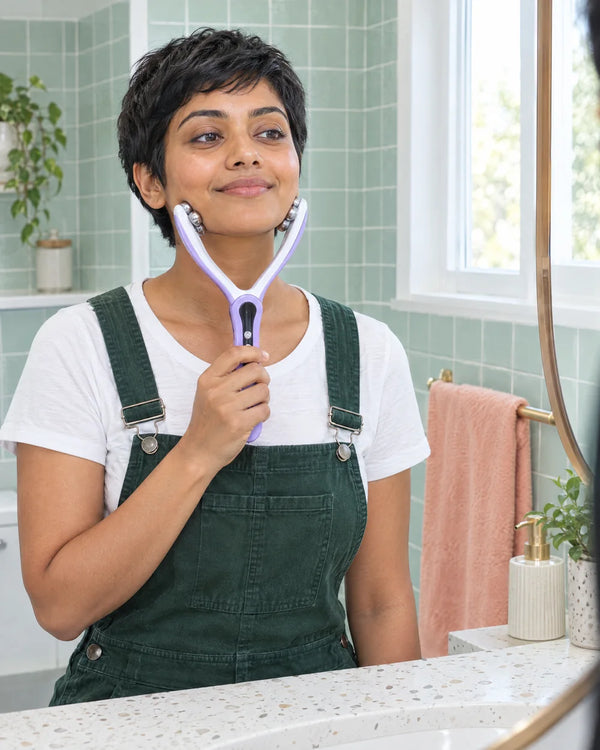 AI-created lifestyle illustration of an adult using the Purple facial roller.