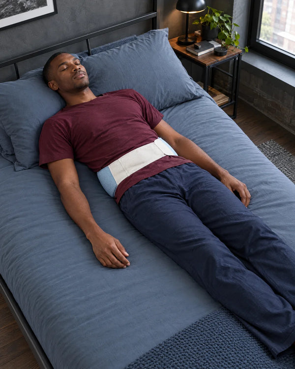 AI-created lifestyle illustration of an adult resting with the blue lumbar sleep support wrap.
